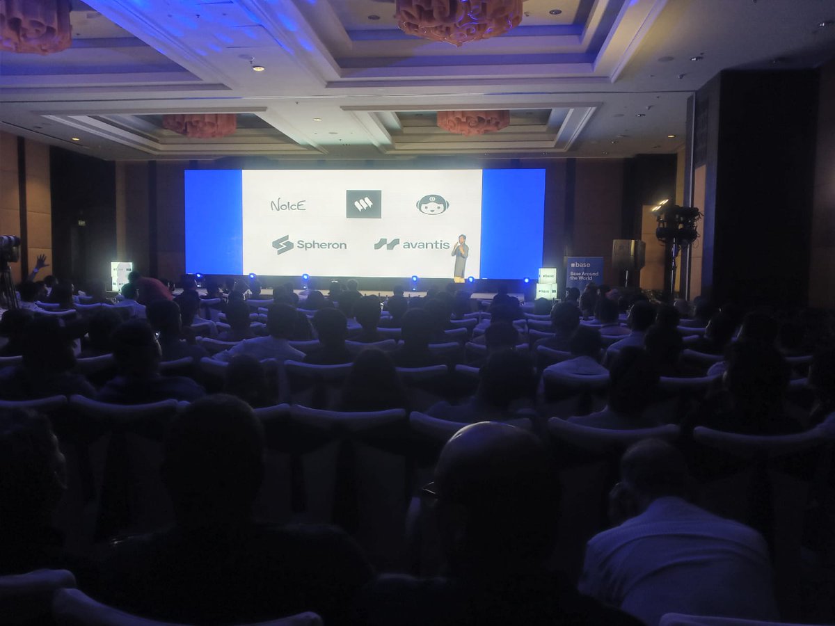Speaker presenting projects like Spheron and Avantis