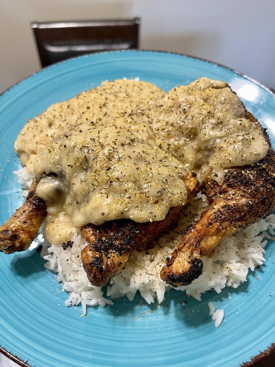Air fryer chicken quarters and homemade chicken gravy over rice