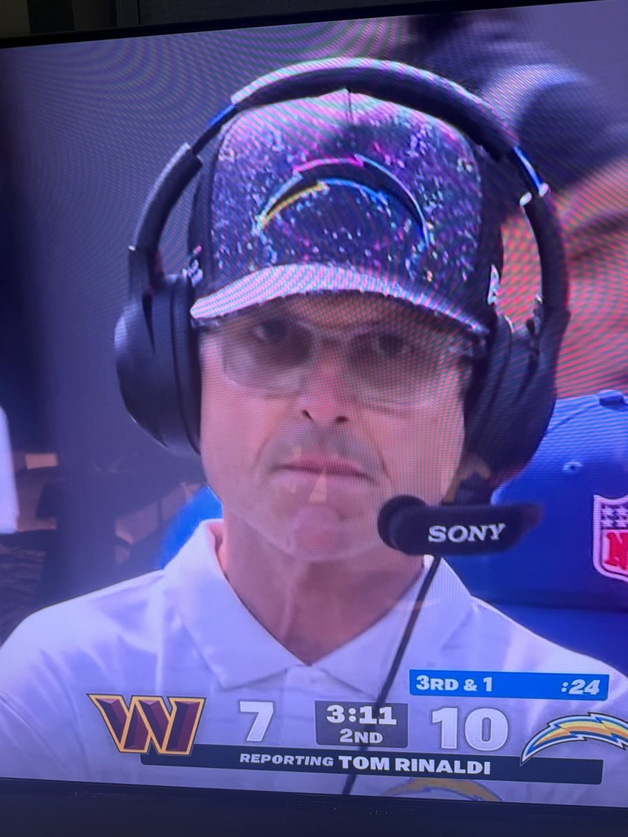 No hat has ever less fit a man than this one on Harbaugh