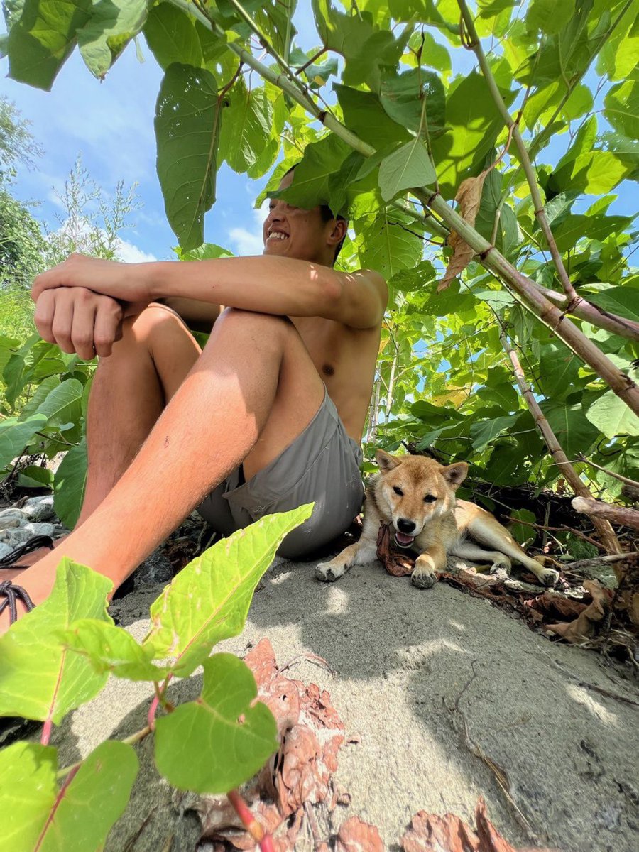 Man and Shiba Inu dog in rural Japanese setting