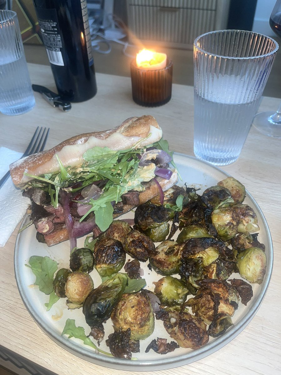 Skirt steak, caramelized onions, organic valley provolone, arugula and homemade chipotle aioli on a sourdough baguette with crispy Brussels sprouts