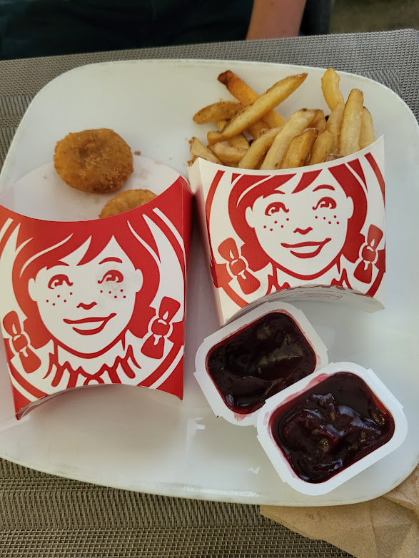 Hey <a href="/WendysCanada/">Wendy's 🇨🇦</a>
Disappointed - kid is a huge Wednesday fan and grampa (who didn't know what to expect) ordered him the Meal of Misfortune today. I get the theming, but this is taking it way too far. This is literally all that came with it. No dessert, matching sauces, no spoon.