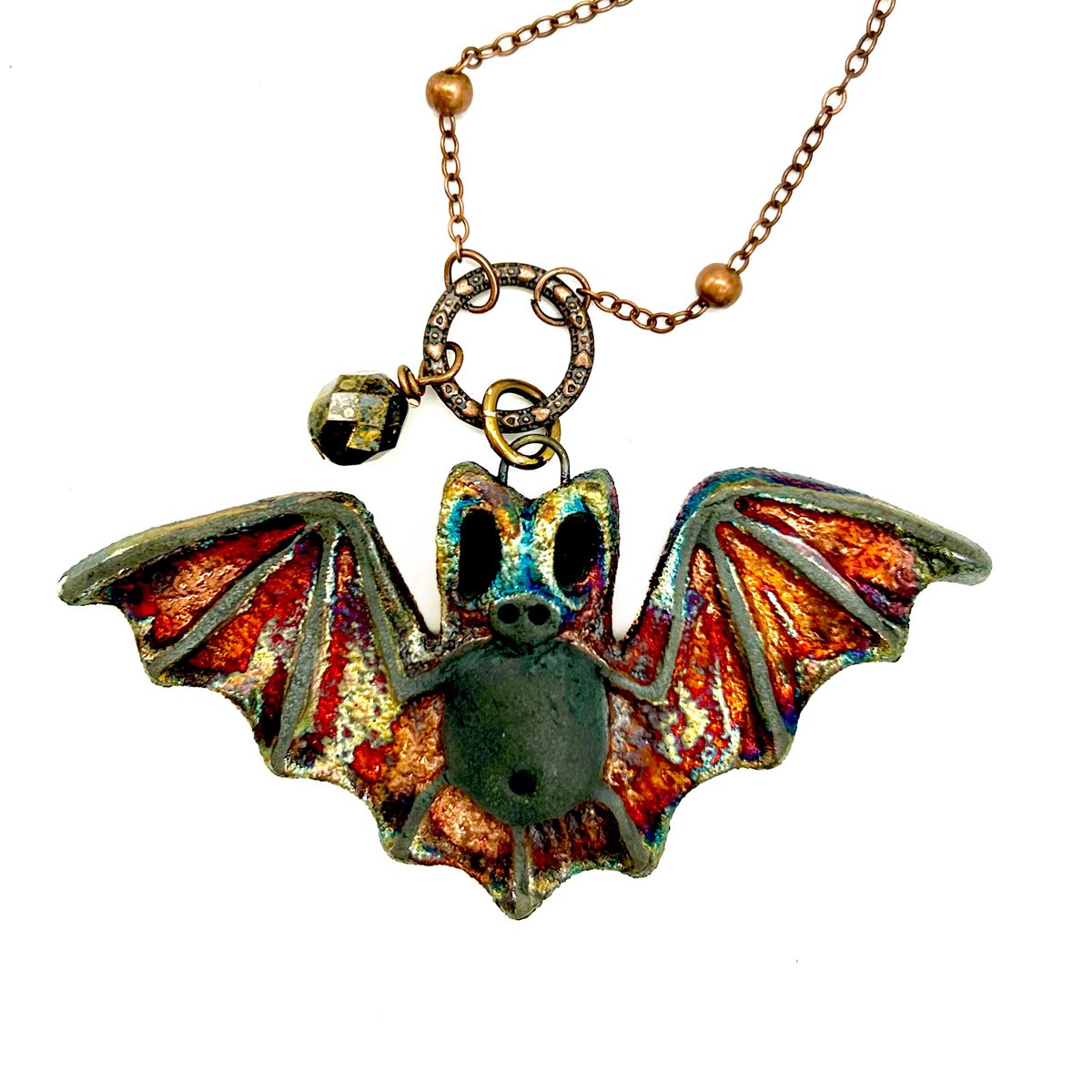 Gothic bat necklace
Raku firing occurs in an oxygen-free environment. This draws the oxygen out of the glaze creating gorgeous metallic effects.
zencatpottery.etsy.com/listing/438185…
#GothicJewelry #BatJewelry #BatLover #BatLoverGift  #rakupottery