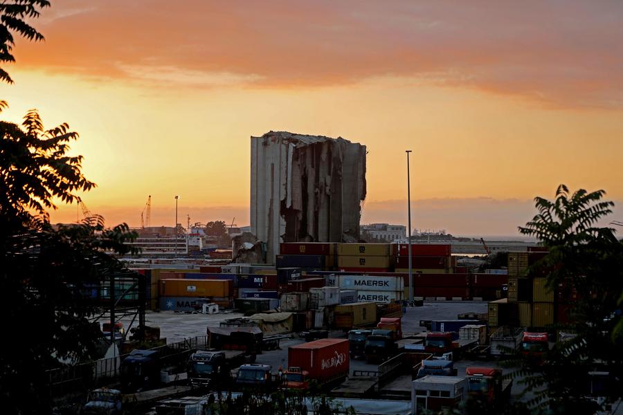 XHNews's tweet photo. #LetterFromMideast: Five years after the Beirut port explosion, the grain silo that took the brunt of the blast and shielded half the city from greater ruin still stands -- scarred, silent, and monumental https://t.co/R9WmTeFOaj https://t.co/5O7FfkGebK