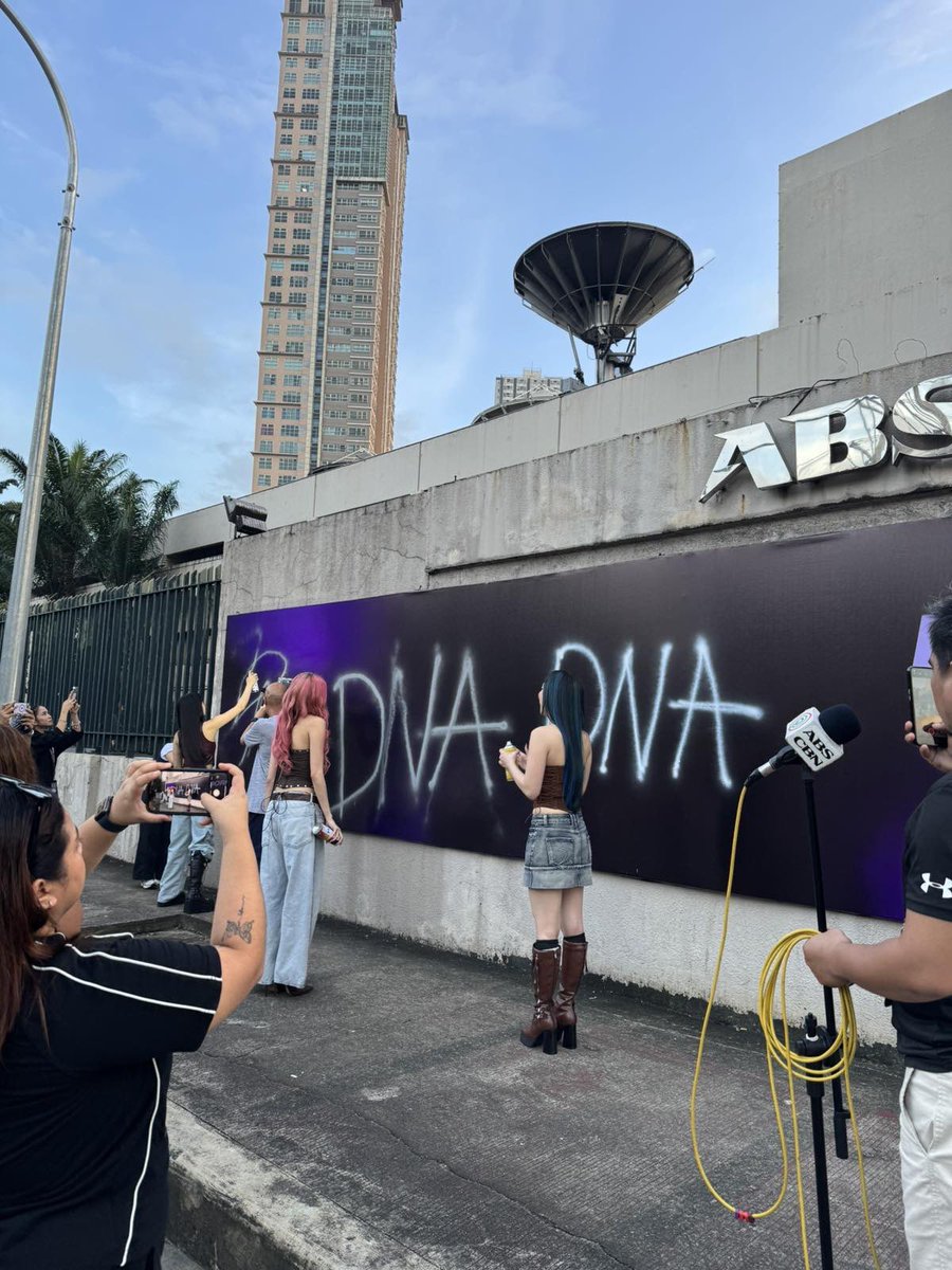 ABSCBNpr's tweet photo. BREAKING: The power of three leaves their mark.
#DNA finally reveals their name — spray-painted across their own billboard.
#WiredToCreate https://t.co/nVRqcAFBTk
