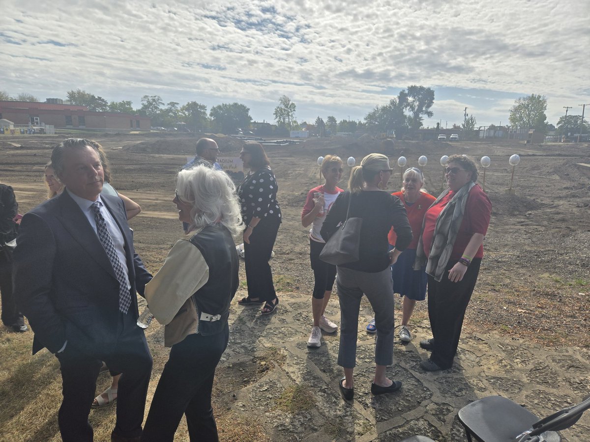 Crowds gathering for groundbreaking for Beyer Stadium improvements before the return of women's baseball.