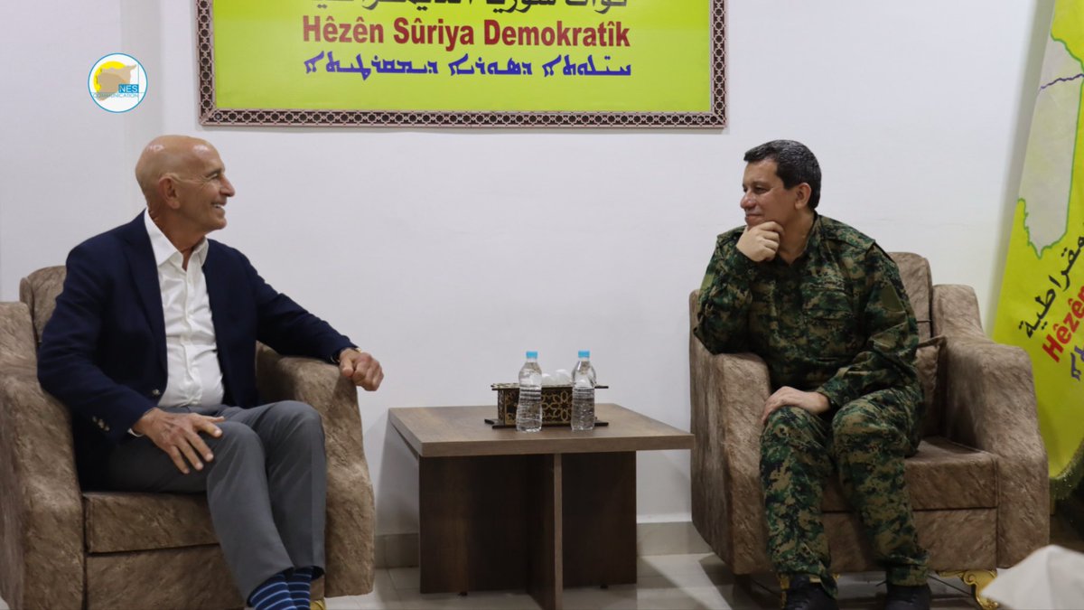 nes_comm's tweet photo. The Commander-in-Chief of the Syrian Democratic Forces, General Mazloum Abdi @MazloumAbdi , received this morning U.S. Ambassador to Türkiye and Special Envoy to Syria Tom Barrack @USAMBTurkiye , along with @CENTCOM Commander Admiral Brad Cooper, leading a U.S. delegation from the International Coalition.

The meeting was attended by Ilham Ahmed @ElhamAhmadSDC (Co-Chair of the Foreign Relations Department), Rohlat Afrin (Leader of the Women’s Protection Units), Ghassan al-Yousef (Deputy Head of SDC), and 
Abed Hamed Al-Mahbash
Chairman of the Future Syria Party

Talks focused on practical steps to accelerate the implementation of the March 10 Agreement signed between Syrian transitional President Ahmad al-Shar’a and General Mazloum Abdi . 

And facilitating the lifting of sanctions on Syria, creating a safe environment for investment and development, and facilitating the return of displaced people.

Both sides reaffirmed their commitment to continued partnership between the International Coalition and the SDF in combating ISIS and strengthening regional stability and security, in a way that preserves Syria’s territorial integrity.