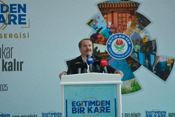 A man in a suit stands at a podium with multiple microphones, including red and black ones, speaking at an event. Behind him, a large banner displays "Eğitimden Bir Kare Fotoğraf Sergisi" with text reading "Hayat akar fotoğraf kalır" and dates "6-12 Ekim 2025." The banner includes logos and images of people and nature. Another image shows a group of people, including men in suits and a woman in a beige coat, cutting a red ribbon in a spacious indoor area with trees and a glass ceiling.