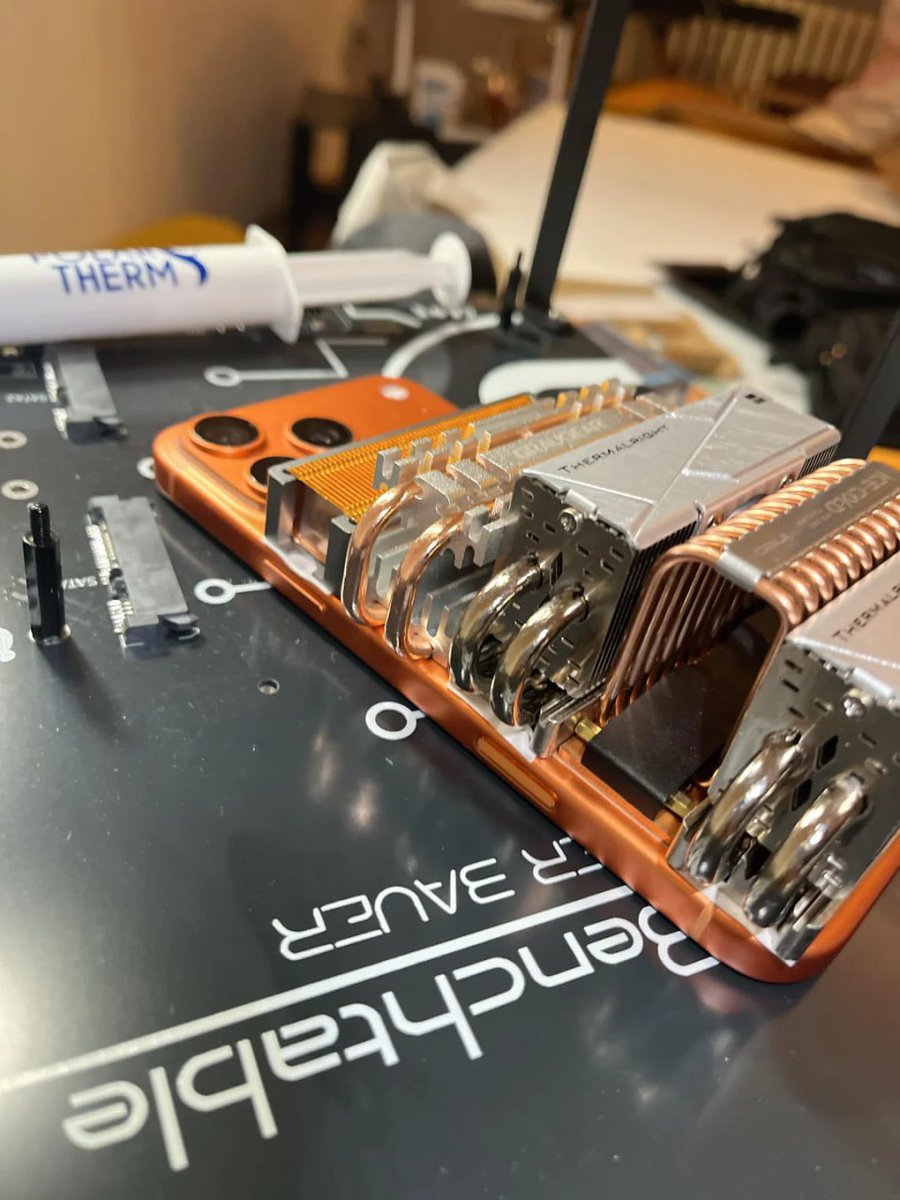 efkrasicki's tweet image. 🔥 Meme of the day: a Redditor just defeated throttling on the iPhone 17 Pro Max.
All it took was 5 SSD coolers — now the phone doesn’t overheat, even under heavy load.
Upgrade cost: ~$100
good luck fitting it in your pocket 😅
#iPhone17ProMax #TechHumor #DIY