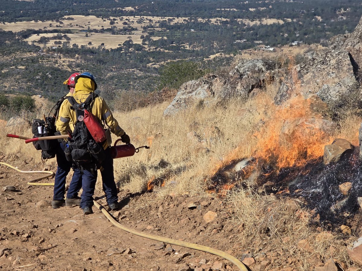 CALFIRE_ButteCo's tweet photo. Burning has begun on the #PhoenixVMP. The goal is to burn 433 acres over the next three days off Forbestown Road east of Oroville. Four Crews, 13 engines, and two dozens are here, along with several water tenders and overhead personnel, to ensure a safe and successful operation. https://t.co/N8zTyPXN0F