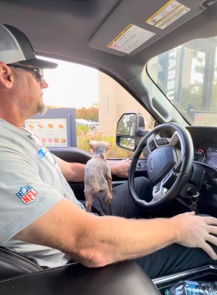Every photo of big Dan Campbell going through the coffee line with his little dog makes me smile.