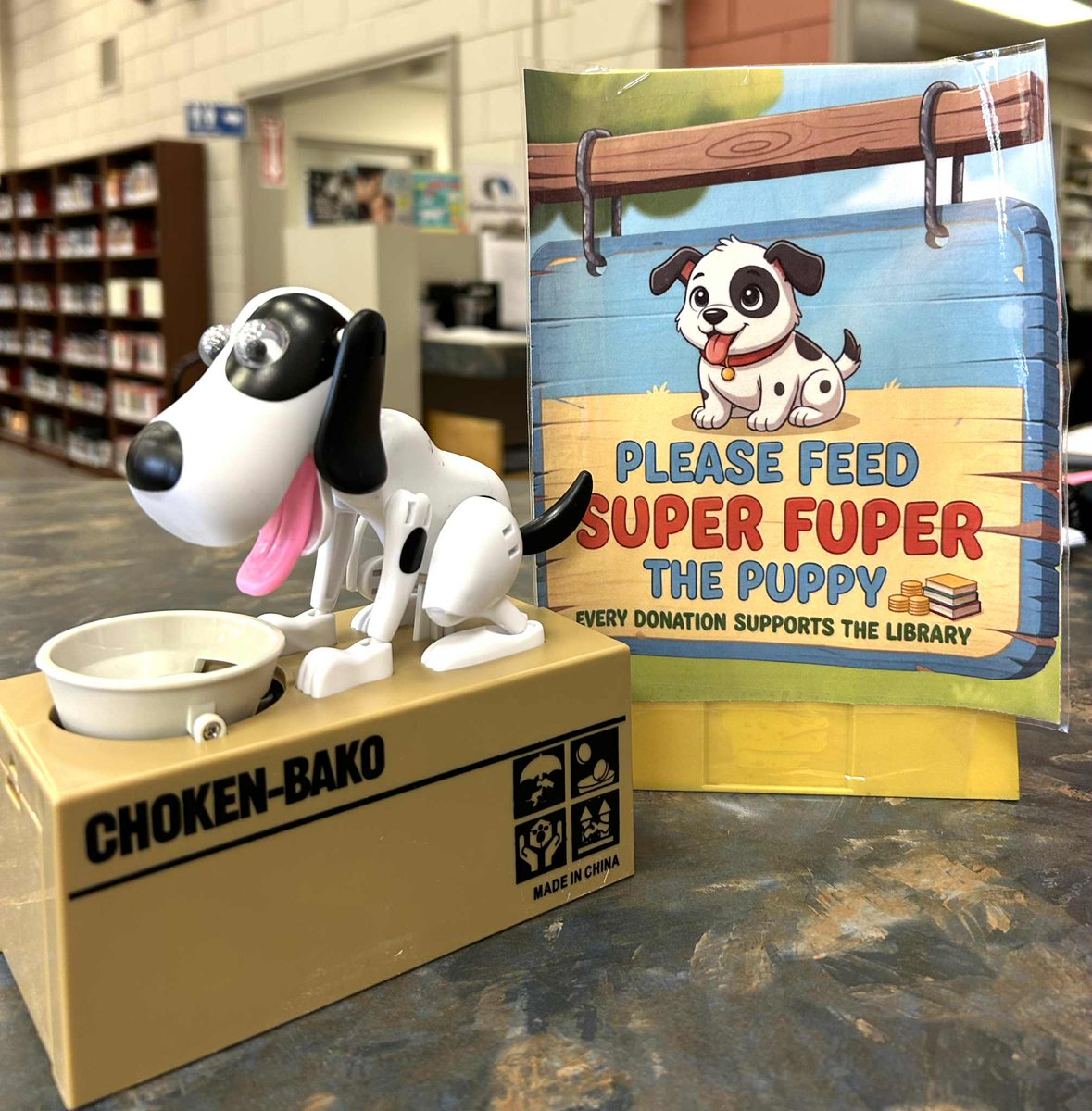 CLPublicLibrary's tweet image. Our new Library puppy at the South is very hungry drop by and give her some change to make change happen at Library .