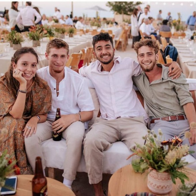 EBluemountain1's tweet photo. This is the last photo of Aner and Hersh at my niece's wedding in summer 2023. Two joyful young men, full of life, wanderlust, and love for family and friends. 
Two years ago today, Aner heroically died saving others, while Hersh, his arm blown off, was kidnapped, tortured, and eventually executed in a dark tunnel by bloodthirsty Jew-haters.
#ForeverYoung
#10/7