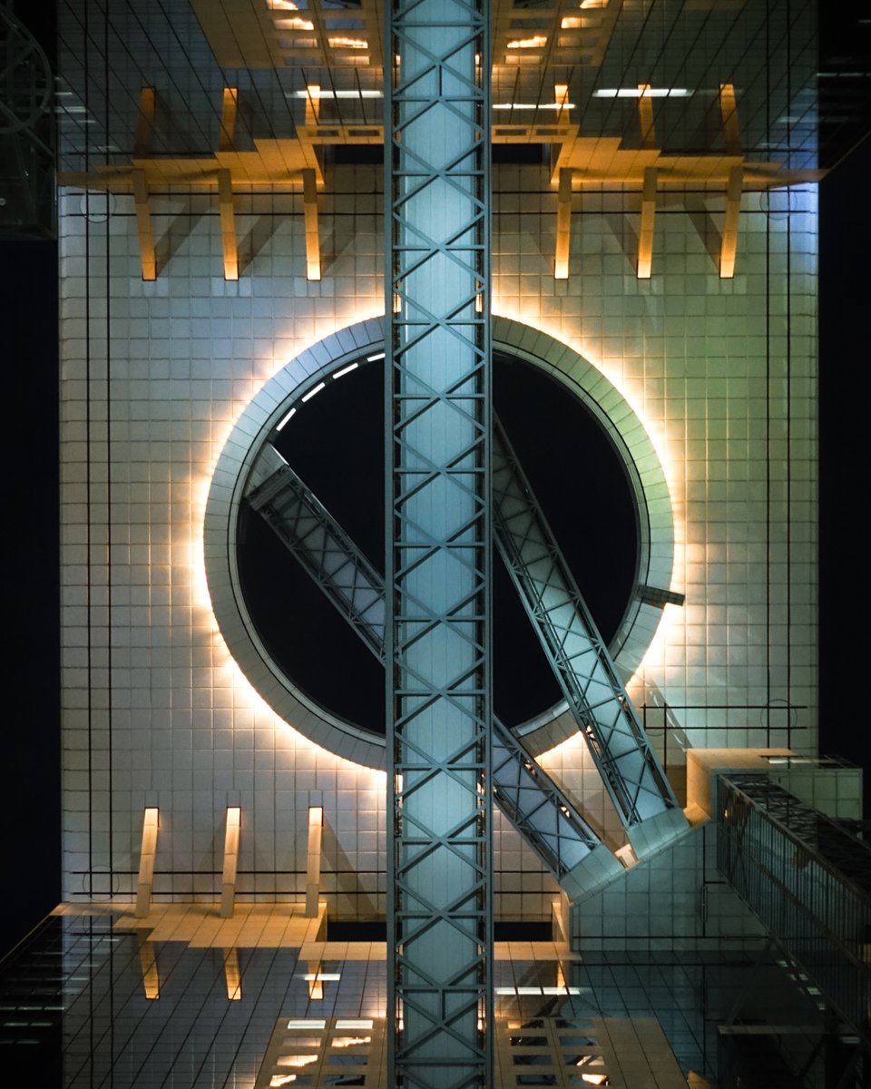 Looking up at Umeda Sky Building in Osaka feels like staring into another dimension 🚀 🇯🇵