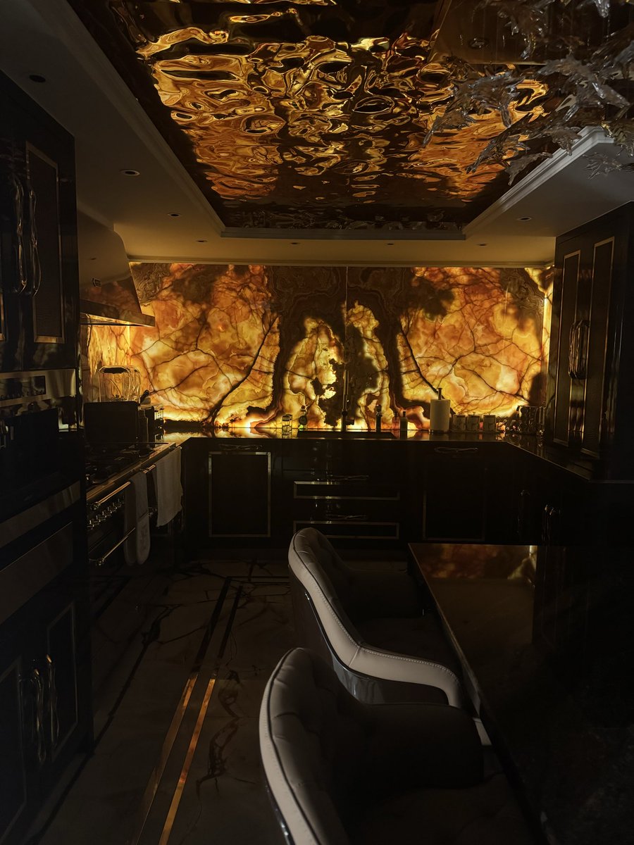 Let there be light 🔥 obsessed with our new kitchen wall . Natural stone brown onyx , striking 💥