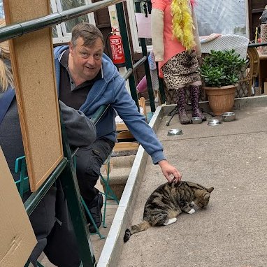 AllotmentCat's tweet photo. (Amanda) 
On Saturday some of the humans had a thing called a 'Coffee Morning'. 
About 20 of them sat in the veranda and talked to each other.
They seemed to enjoy it and they will have another on next month.
I went too, just to see what it was like.
It was alright, and some of the humans made a fuss of me but it wasn't  really my sort of thing.
But I'm glad the humans liked it.
 Being friendly is a good thing, isn't it?