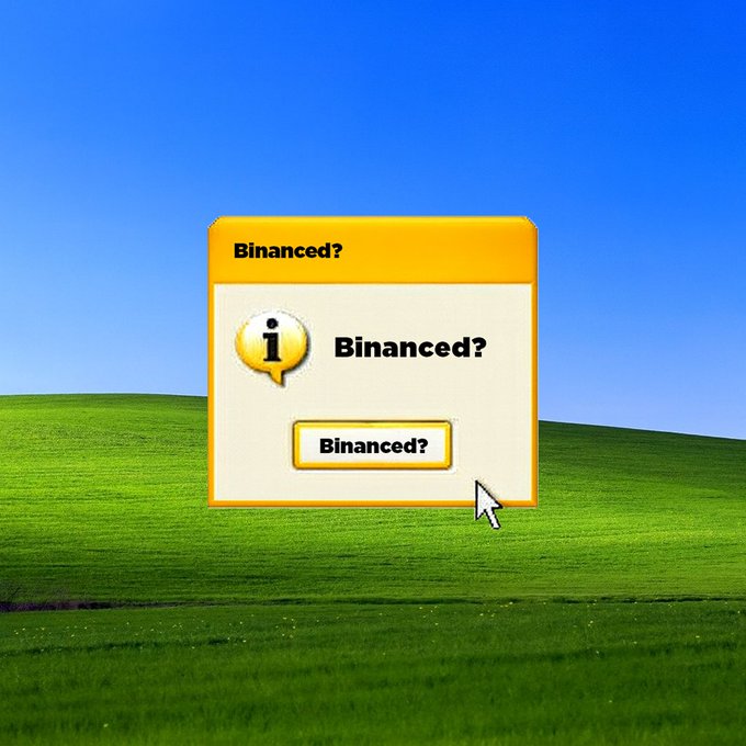 A simulated Windows XP desktop background with green hills and blue sky displays a yellow alert-style popup window titled Binanced? containing a white information icon with exclamation mark and the repeated text Binanced? in black font. A white mouse cursor arrow points toward the popup window. The Binance orange logo appears integrated into the notification design.