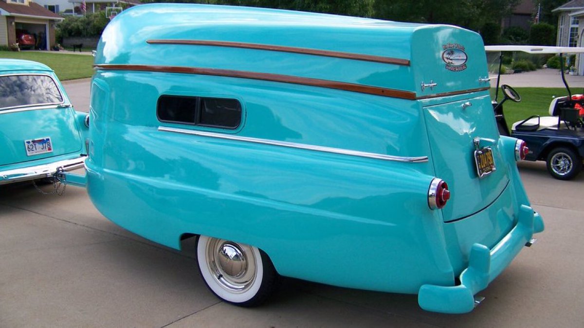 A 1954 camper with a removable 16-foot boat that doubles as its roof