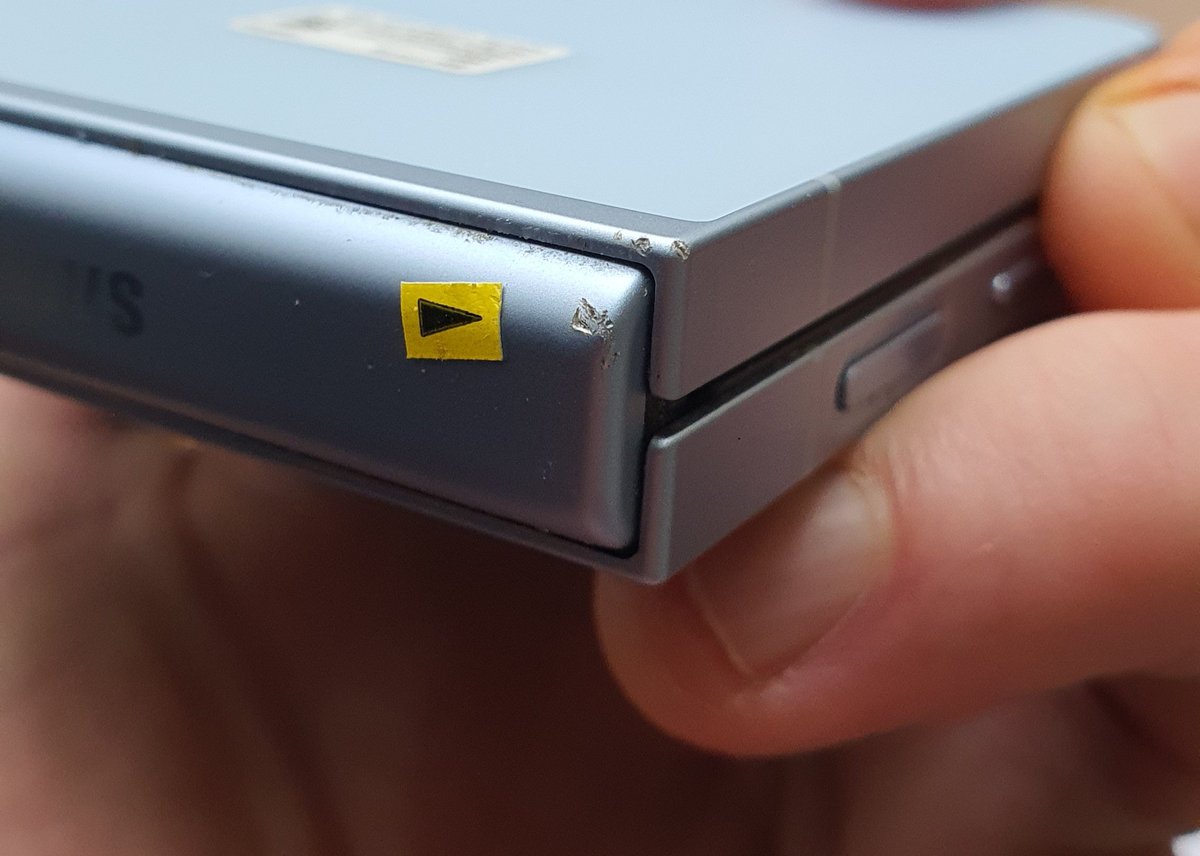 Reezla's tweet photo. So apparantly THIS is the damage that @tescomobile think caused my entire inner screen to not work therefore not qualified for a warranty repair. Absolute crooks! Thanks for the sticker pointing it out for me cos i never would have guessed either https://t.co/bPt3A6D9SO