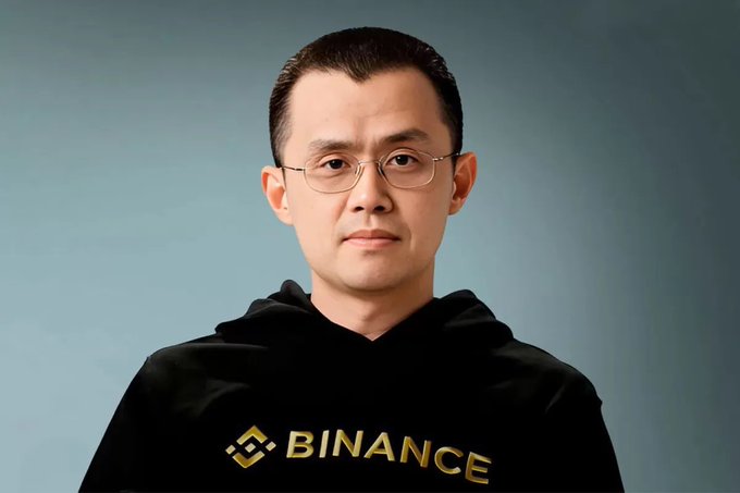 First image shows a man with short black hair and glasses wearing a black hoodie featuring the yellow Binance logo, standing against a blue-gray background. Second image is a screenshot of a tweet by CZ from Binance account, including his profile picture, text about not expecting the BNB meme season and people asking to predict the future, hashtags BNB and BNBmeme szn, and emojis.