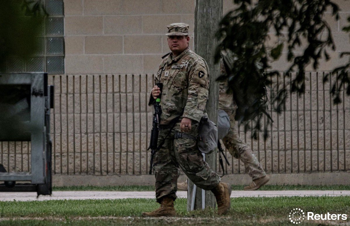 idreesali114's tweet image. Texas Army National Guard 36th Infantry Division troops walk through the Joliet Army Reserve Training Center, after President Trump ordered increased federal law enforcement presence to assist in crime prevention, in Elwood, Illinois, U.S. October 7, 2025.  REUTERS/Jim Vondruska
