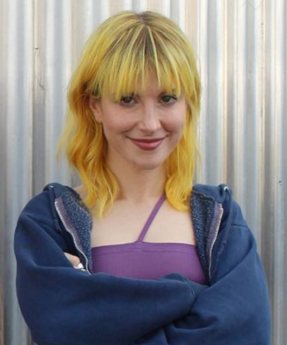 the face of a woman who is planning something insane for tomorrow
