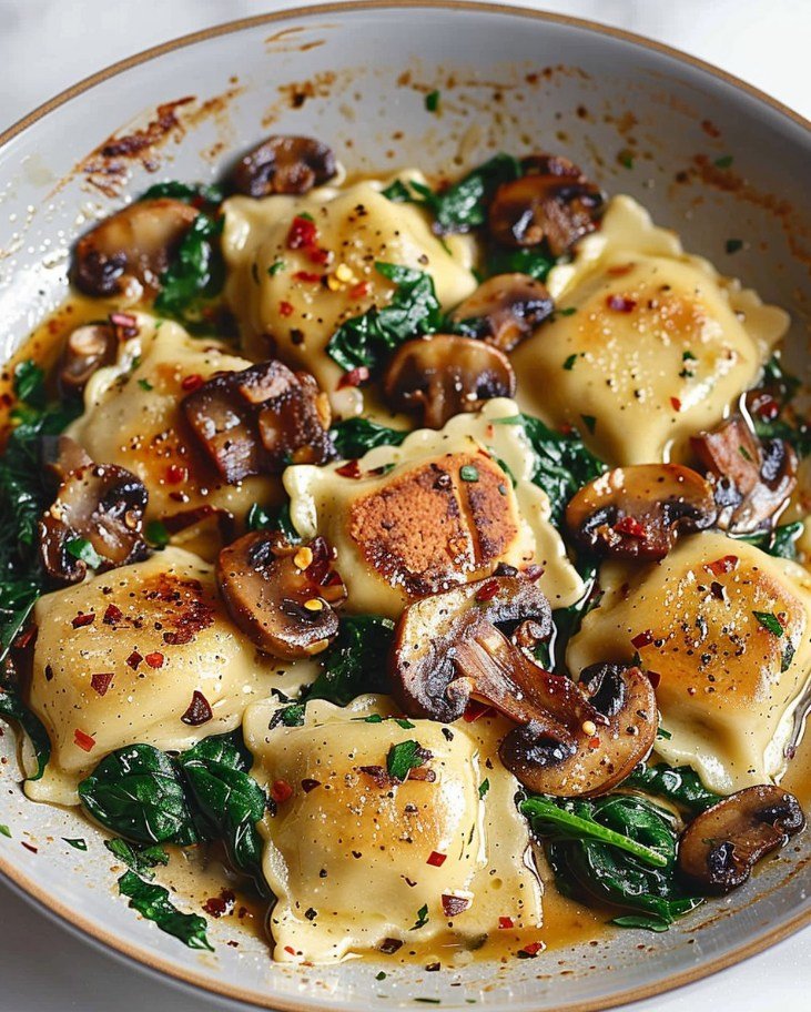 This Mushroom Ravioli in creamy Parmesan sauce is a must-try for any pasta lover!
