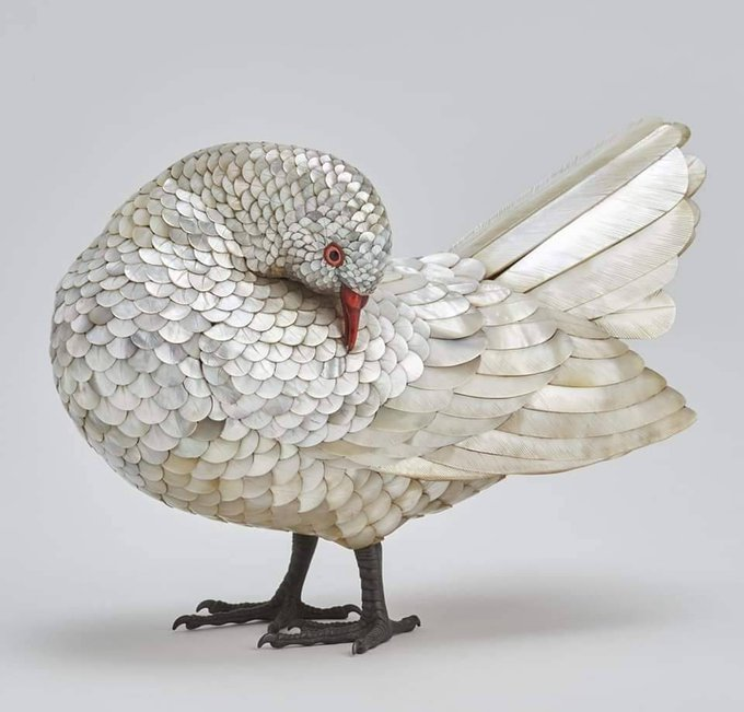 xmuse_'s tweet photo. Crafted circa 1880 in Japan, this exquisite life-sized pigeon features intricately inlaid mother-of-pearl feathers on a wooden form, complete with bronze legs. 

A remarkably realistic representation. 🕊 https://t.co/dR4k1YRFKM