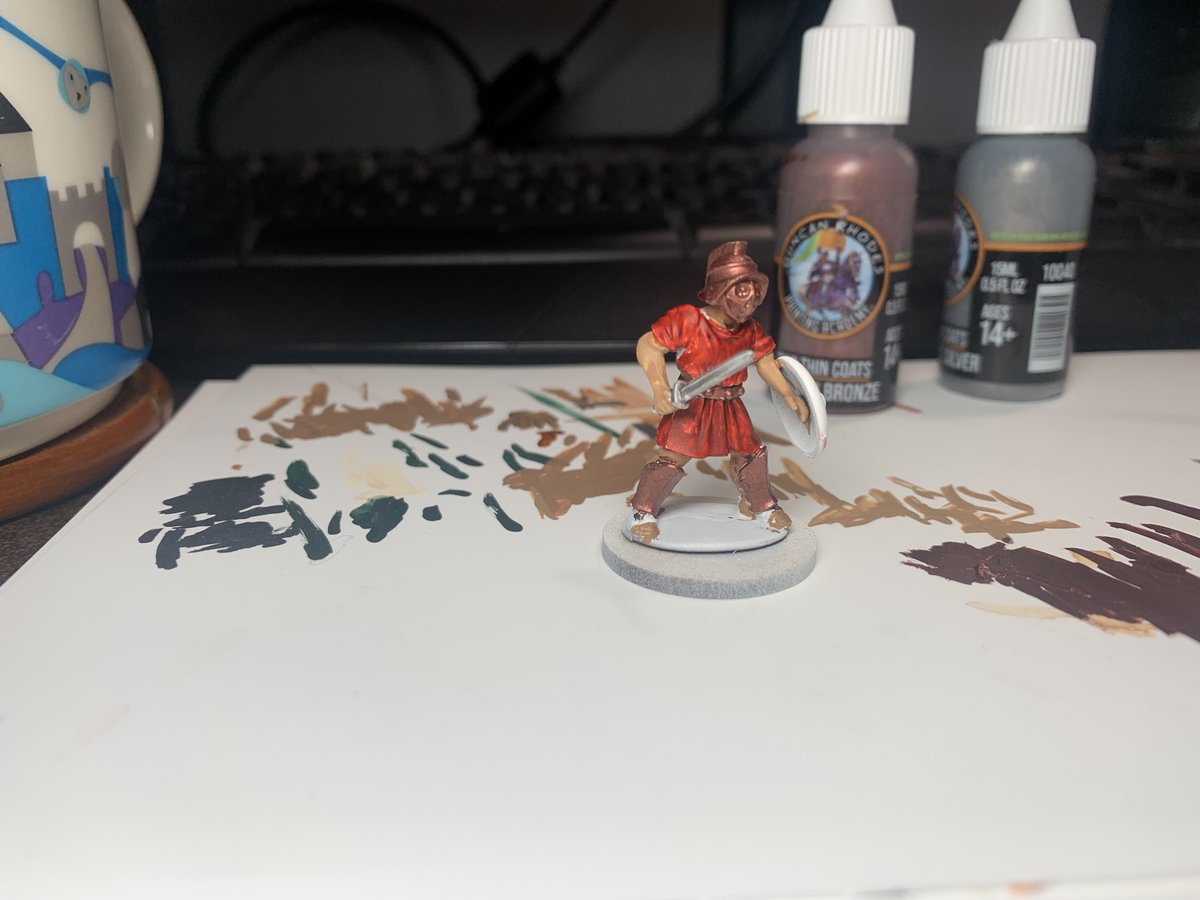 Djmaclure's tweet photo. Had time this morning to do some painting on this warrior for Gangs of Rome on day #1433 of the #hobbystreak. After finding out bronze was used for the armour for gladiator, I based coated the greaves, helm and belt with some Spartan Bronze. #GangsofRome #miniaturepainting #historicalminiatures