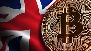 A golden Bitcoin symbol with circuit patterns is centered over a waving Union Jack flag in blue red and white, creating a composite image representing cryptocurrency in the UK context.