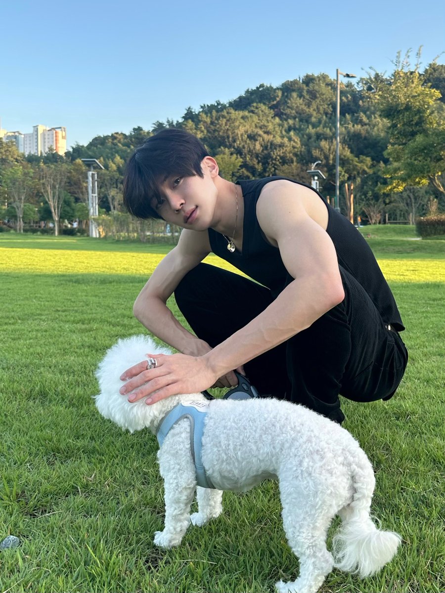 picking up his dog to go thirst trap at the park he is a sick individual
