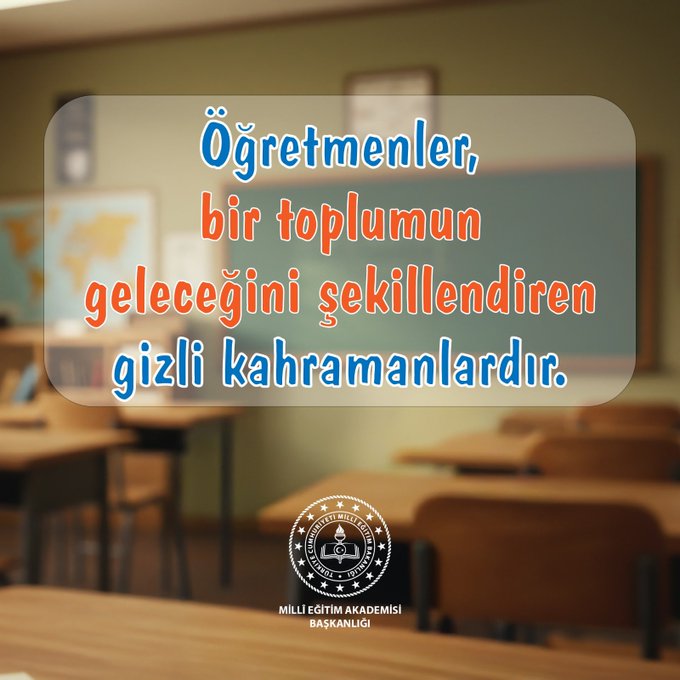 A softly lit classroom interior with wooden desks arranged in rows facing a green chalkboard on the wall. A transparent overlay box in the center displays orange-highlighted Turkish text reading Öğretmenler, bir toplumun geleceğini şekillendiren gizli kahramanlardır. The Milli Eğitim Akademisi Başkanlığı logo appears in the bottom right corner. No people or additional objects are visible.