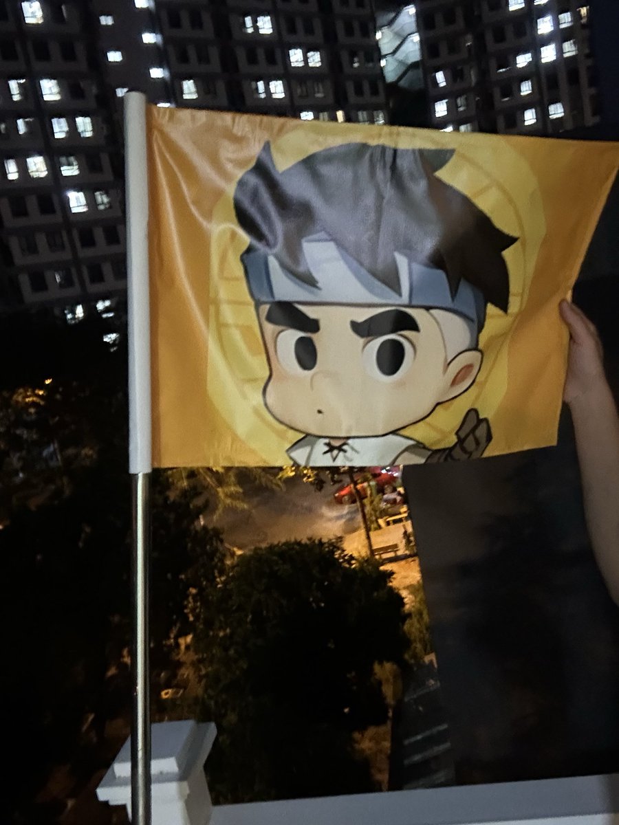 Hey hey Lumi fam 🟨

Some flags mark nations.
This one marks spirit. ⚡️

Under city lights, a yellow flag waves, not for territory, but creativity.

That character on it? Not just art. It’s attitude. Every silent builder who dares to create and shine loud in color.

We raise it