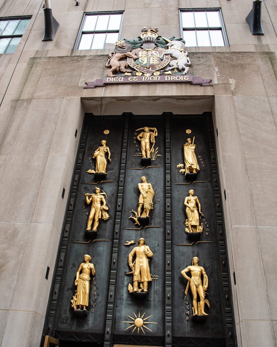 The bronze doors of the British Empire Building, located at 620 Fifth Avenue in Rockefeller Center, New York City.