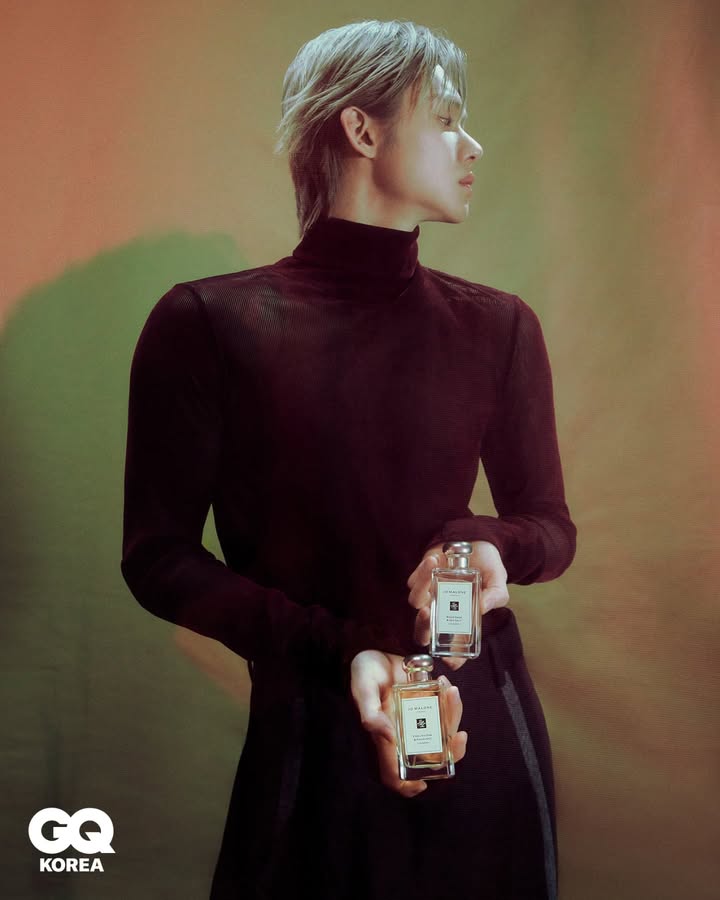 Exuding an atmosphere of sophisticated allure, My profile pose highlights the elegant lines of his form. Dressed in a sleek, almost translucent turtleneck that subtly reveals, he presents the fragrances with an air of refined mystery, perfectly complementing warm gradient.