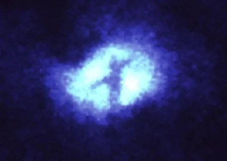 trad_west_'s tweet photo. Nasa finds cross-like shape at the heart of a galaxy https://t.co/zpQNRyCfhM