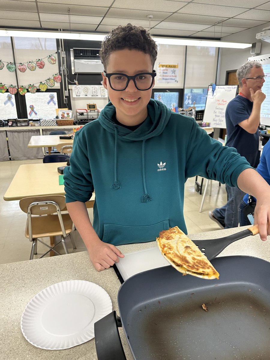 mrs_mnaro's tweet photo. Today’s cooking lab: Beefy Cheesy Quesadillas! Working on our flipping skills and kitchen knife safety. Students worked through the recipe together and the finished product was pure deliciousness!! Way to go, young chefs! 🖤🧡 @HTSD_Grice @WeAreHTSD https://t.co/iAWEJKEOaO