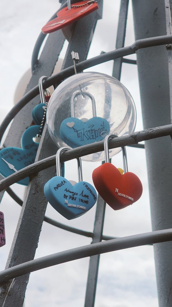 "This collaboration, the first between a K-pop group and N Seoul Tower, runs from the 8th to the 14th.

Fans can buy the TREASURE HUNT Package, decorate a love lock for the KEEP YOUR TREASURE Tree, and complete missions like taking N Photo shots with Treasure-themed props to earn