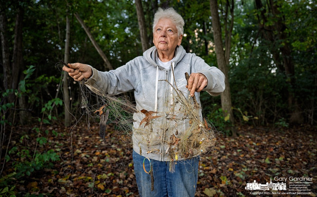 Pat Andrei holds a tangled collection of fishing line and lures she gathered during a walk along a short stretch of the Hoover Reservoir shoreline. My Final Photo for October 8, 2025. 1l.ink/V7M746J