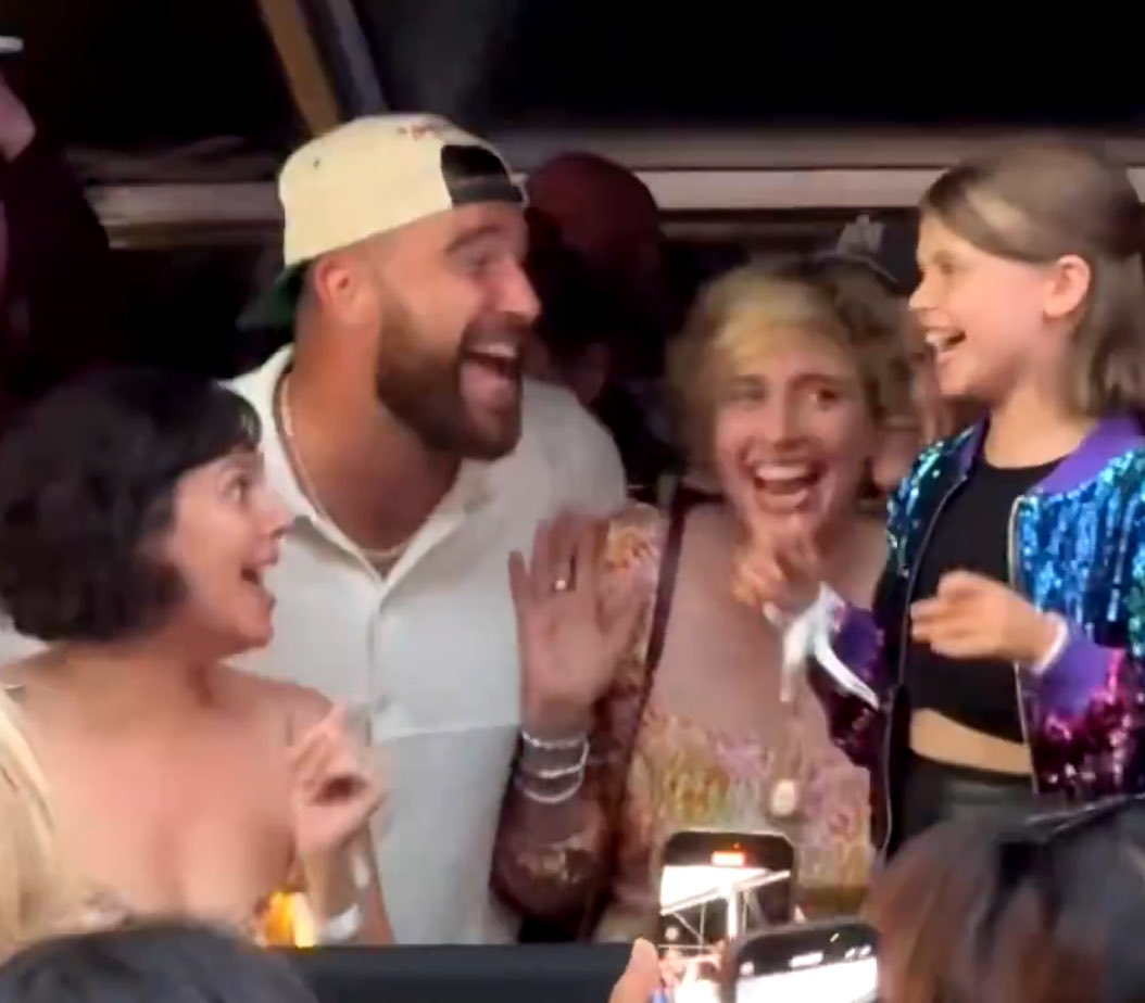 meanwhile this is travis at the front of the tent with a “random family”