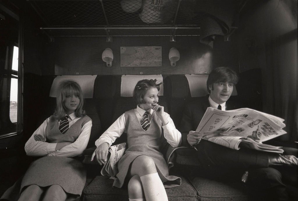 groovyboyd's tweet image. Happy heavenly 85th birthday, John Lennon! 🤍 
Here is Pattie Boyd &amp;amp; Prudence Bury with John Lennon on the set of A Hard Day&apos;s Night, March 1964. 
📸 by Max Scheler