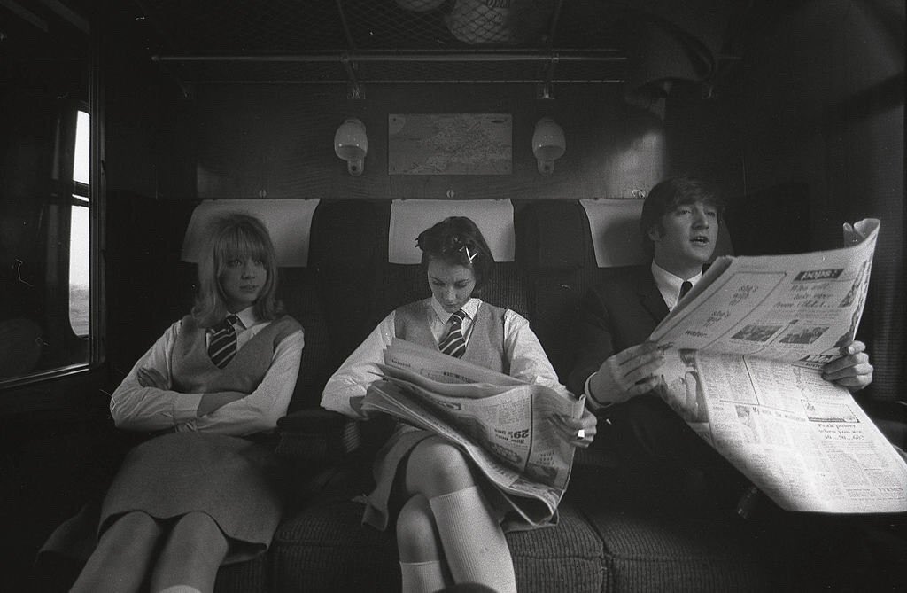 groovyboyd's tweet image. Happy heavenly 85th birthday, John Lennon! 🤍 
Here is Pattie Boyd &amp;amp; Prudence Bury with John Lennon on the set of A Hard Day&apos;s Night, March 1964. 
📸 by Max Scheler
