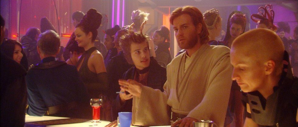 FilmEasterEggs's tweet image. In 'Attack of the Clones' the actor that tries to sell Obi-Wan death sticks plays Mouse in 'The Matrix', the creator of the Woman in the Red Dress program

Later in the scene, the same woman from the Red Dress program can be seen giving a (unsuccessful) seductive look at Anakin