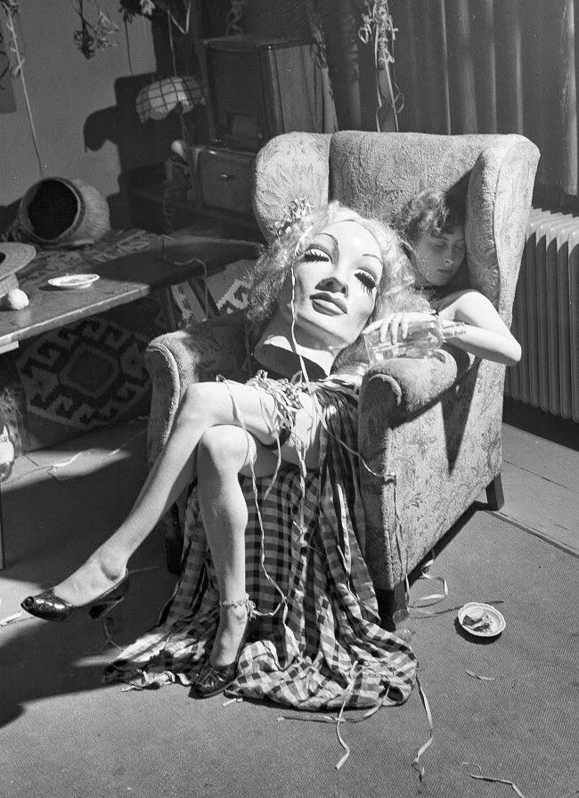 Young artist asleep with Marlene Dietrich's head on her lap, 1950