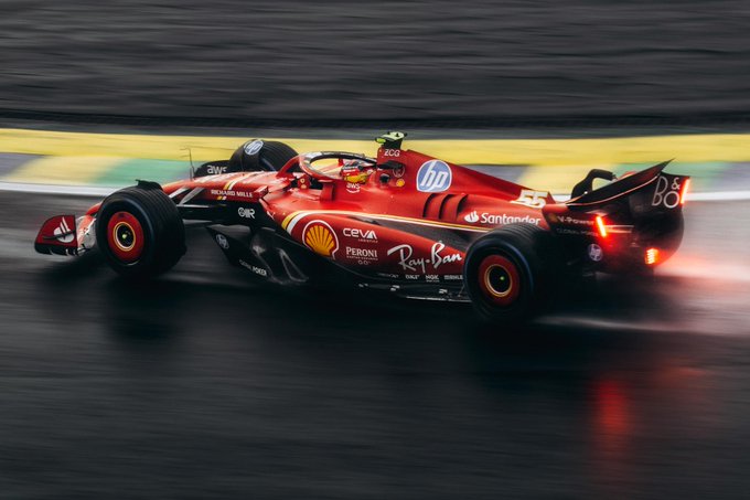 First image shows a red Ferrari Formula 1 car number 16 speeding on a wet racetrack with visible tire spray and flames from exhaust during a race featuring sponsor logos like HP Santander and Shell on the body and a driver in green helmet. Second image depicts a blue and orange McLaren Formula 1 car number 24 on a dry track at the Mexican Grand Prix with yellow barriers sponsor banners for Oracle and Salesforce in background and crowd of spectators watching from stands.