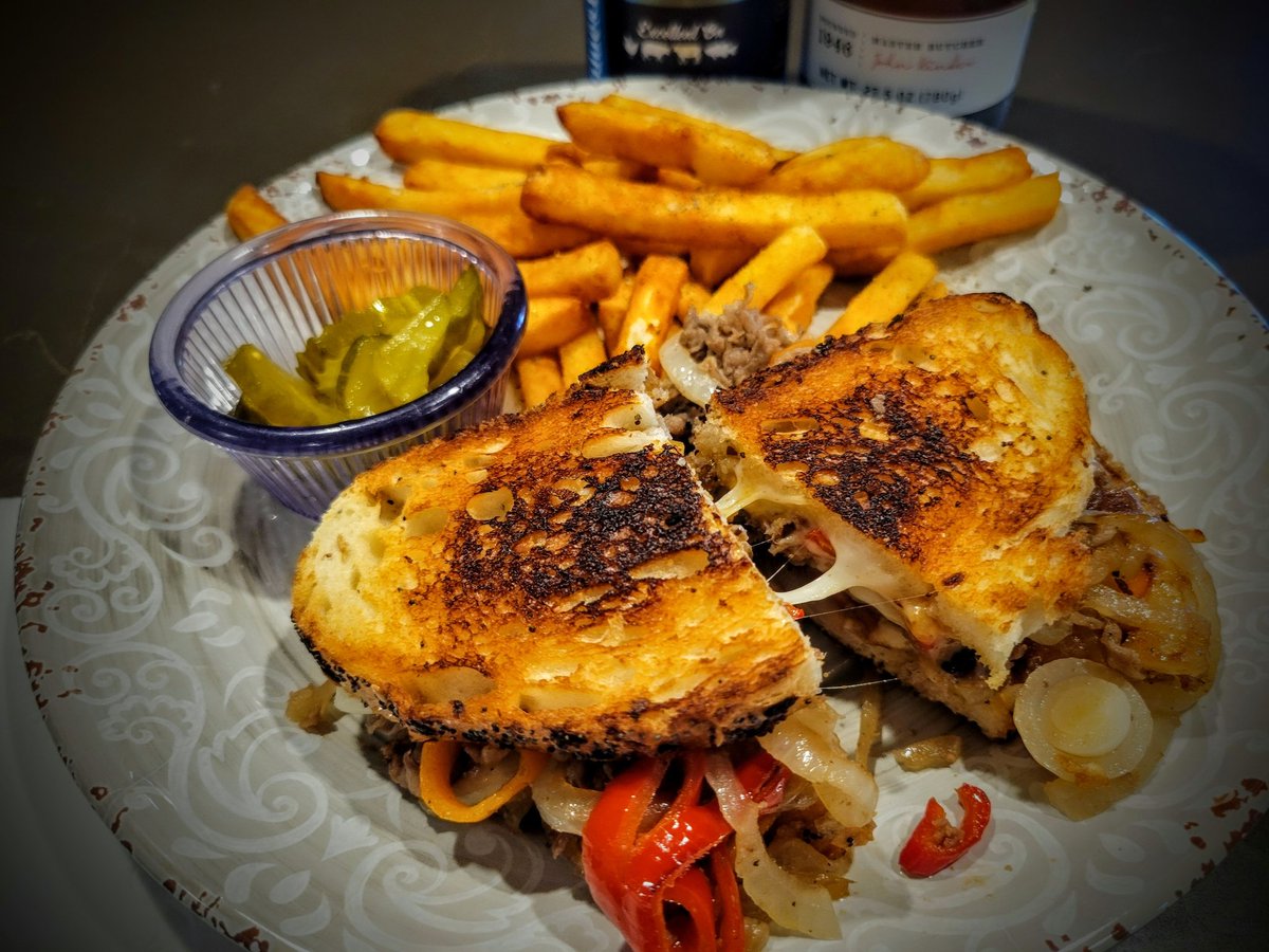 Tuesday Night Cheesesteak Melts with fries and pickles is what's for Dinner at DJ's Bistro