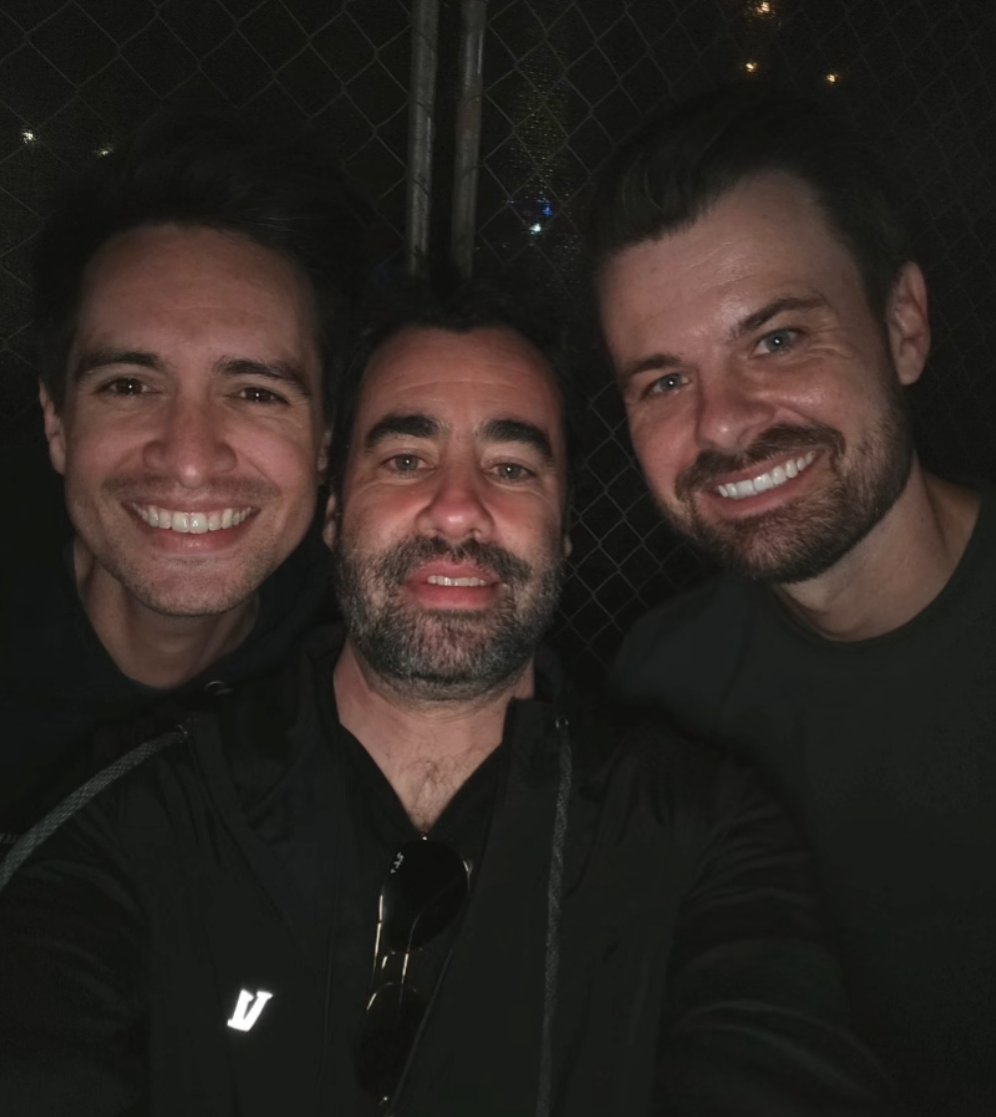 SOTSPodcast's tweet photo. Brendon Urie and Spencer Smith reunited with Matt Squire, producer of Panic! At The Disco's debut album A Fever You Can't Sweat Out, at When We Were Young Festival. https://t.co/aDZd6FTkfc