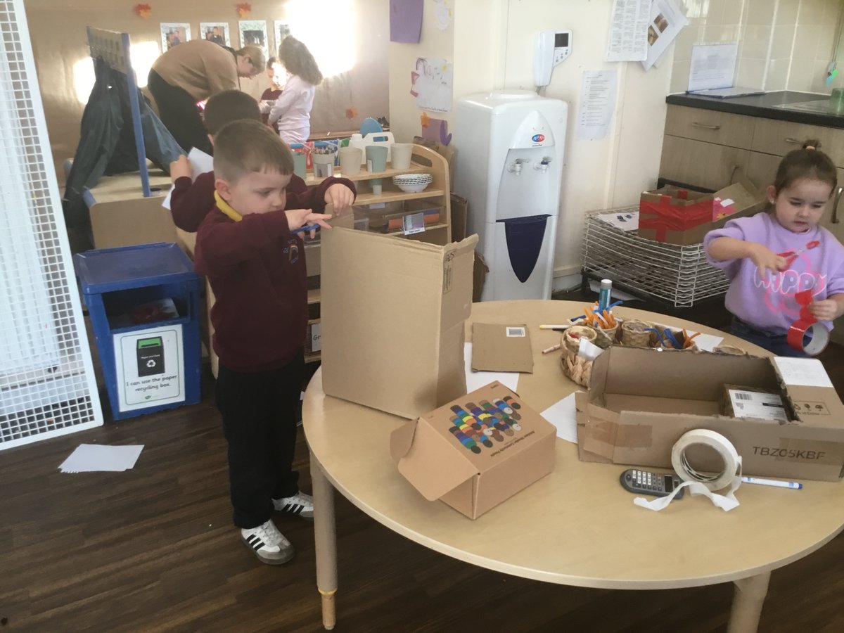 Very busy morning in our arts &amp; crafts area using our scissor skills and imagination to make creations with our junk modelling.