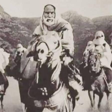 MQqiblawi's tweet photo. “Before the Cowardice and the Kings: When the People of the Region Were One”

For over 20 years, Libya resisted the brutal Italian occupation. This was not just a rebellion, it was one of the strongest resistance movements of its time, winning battle after battle, standing firm against one of Europe’s most advanced colonial powers.

At the heart of this struggle was Sheikh Omar al-Mukhtār, the Lion of the Desert, a leader of unmatched courage, strategy, and honor. He united Muslims and non-Muslims, Sunnis and Shia, Libyans and Arabs, forging a resistance that transcended sect, tribe, and nationality. Fighters came from Syria, Iraq, Palestine, and Egypt, answering the call of justice.

Among those who answered the call was Sheikh Izz ad-Din al-Qassam the Syrian martyr who would later inspire the Palestinian resistance. Before Palestine, he stood with Omar al-Mukhtār in Libya, training fighters, leading volunteers, coordinating campaigns, and strengthening the resolve of the resistance.

This unity was no coincidence. From Najaf, Sayyid Kazem Yazdi, one of our Shia marājiʿ, issued a fatwa calling all Muslims to defend Libya against the Italian invaders. Thousands responded, Shia and Sunni alike, proving that true Islam is solidarity, courage, and standing against tyranny.

Libya’s struggle was not fought on equal terms. The occupiers brought tanks, airplanes, bombs, and industrialized war, innovations first tested on Libyan soil. The resistance had rifles, horses, and raw will. Yet they fought on for decades, carving history with sacrifice and valor.

Libya’s resistance was more than battles; it was a network of solidarity linking fighters across the region, from Libya to Palestine, Syria, and Iraq. The blood of the martyrs was the thread that bound them together.

And even decades later, the fight over Omar al-Mukhtār’s legacy continued. In 2012, Wahhabi-Salafi extremists stormed and desecrated his shrine in Benghazi, the resting place of the nation’s Lion, attempting to erase his memory with the same blind hatred they carry everywhere. But just as the Italians failed to break Libya, these extremists failed to break the people. The shrine was rebuilt, the land protected, and the memory of Omar al-Mukhtār rose stronger a living symbol of defiance, not just against colonialism, but against every form of ideological tyranny.

Omar al-Mukhtār’s courage was not just on the battlefield. He was a man of principles, faith, and honor, said to follow the path of Ahl al Bayt (A.S). His legacy is eternal a symbol of unyielding resistance against colonizers and oppressors, and a beacon for all free men and women.

The lesson for today: do not bow to the defeatist narrative. Opponents may have planes, missiles, and global power, but history proves that will, unity, sacrifice, and faith can outlast and defeat superior force. Maybe not tomorrow. Maybe not in one battle. But the arc of resistance bends toward victory when people refuse to be broken.

Omar al-Mukhtār’s legacy is not nostalgia, it is a living lesson: organize, unite across creeds, train, persevere, and never accept slavery or humiliation. The martyrs of Libya joined hands with brothers from across the region; their blood is the map for every free movement today.

Libya resisted. The martyrs led. The lesson is eternal. Courage, unity, and faith can defeat even the mightiest oppressors.