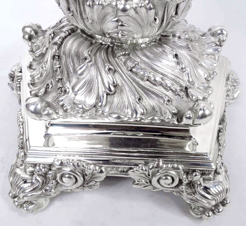 Pair of sterling silver 5-light candelabra by Tiffany &amp; Co., c. 1883. Central flower bud surrounded by five s-scroll arms. Shaft upward tapering with twisted lobes and applied wraparound border set in cast leaf-wrapped base. Fully marked. Item#CC382

nelsonandnelsonantiques.com/items/1509080/…